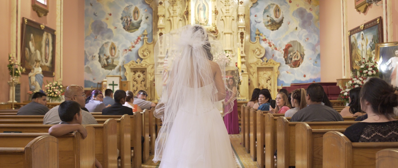 Bride walking the aisle of a gilded church in Avenge the Crows, production design by Myra Barrera
