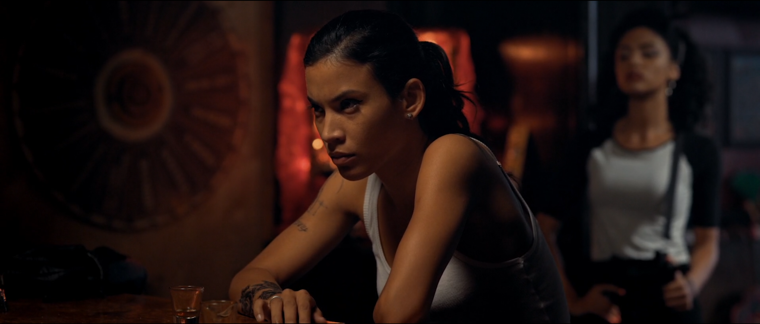 Two characters in a dim interior in Avenge the Crows