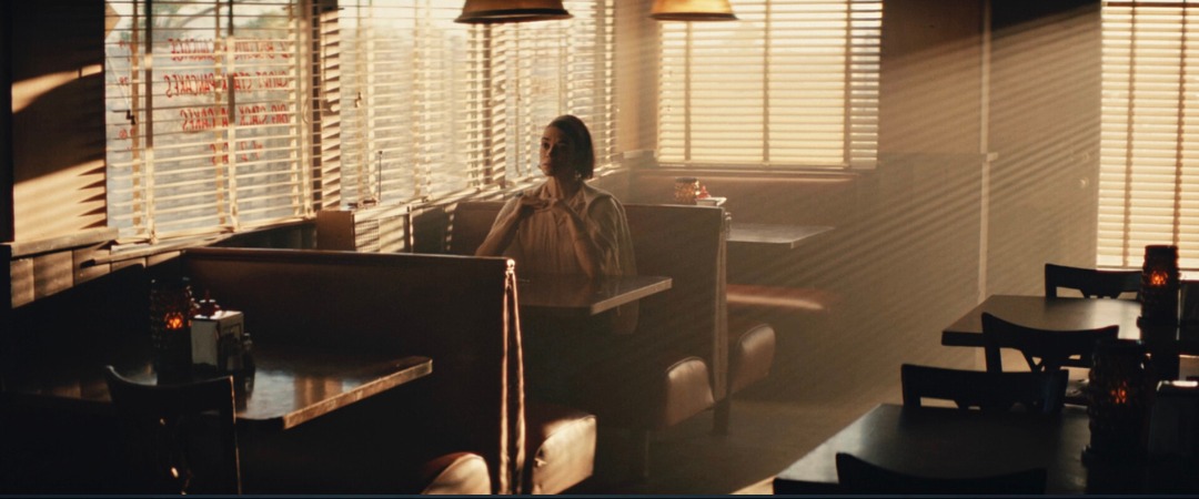Mid-century diner booth in warm light through venetian blinds, Edge of Space