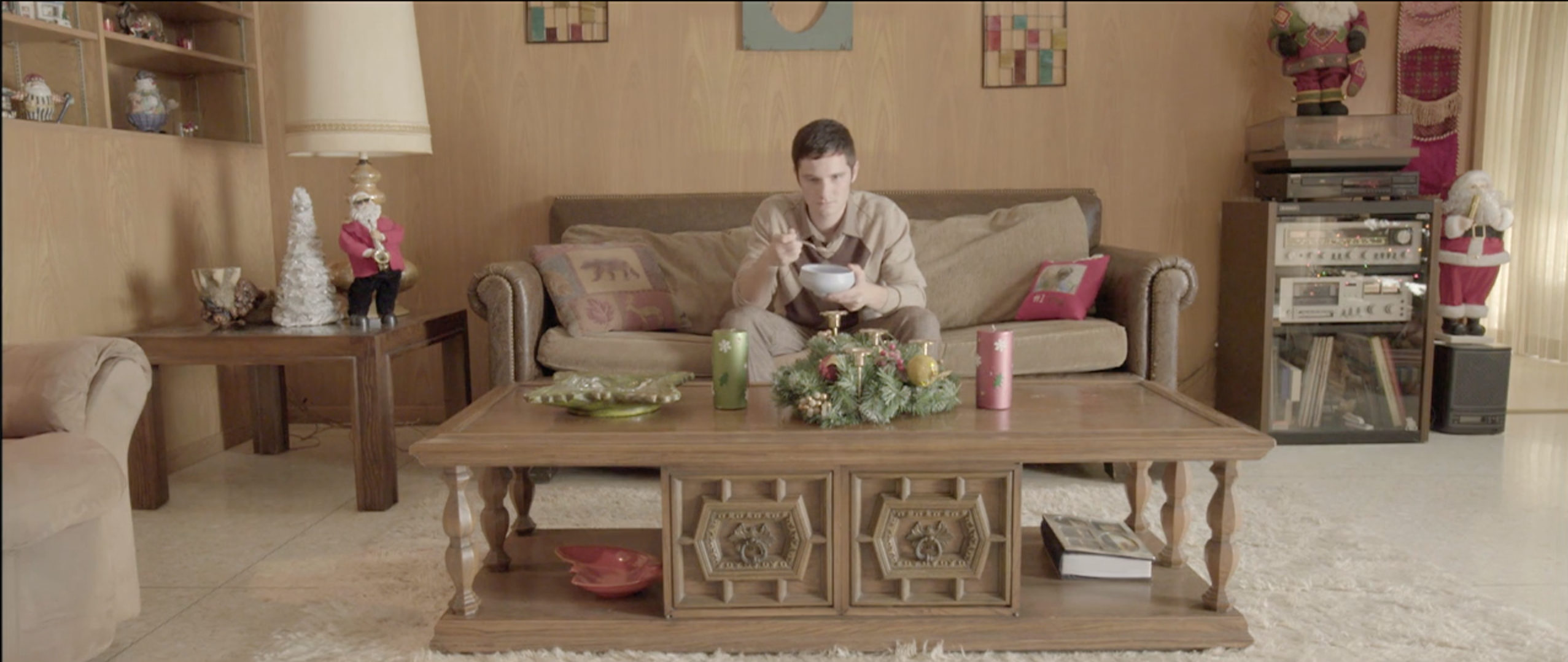 1970s living room with a floral sofa and Christmas dressing, Takanakuy