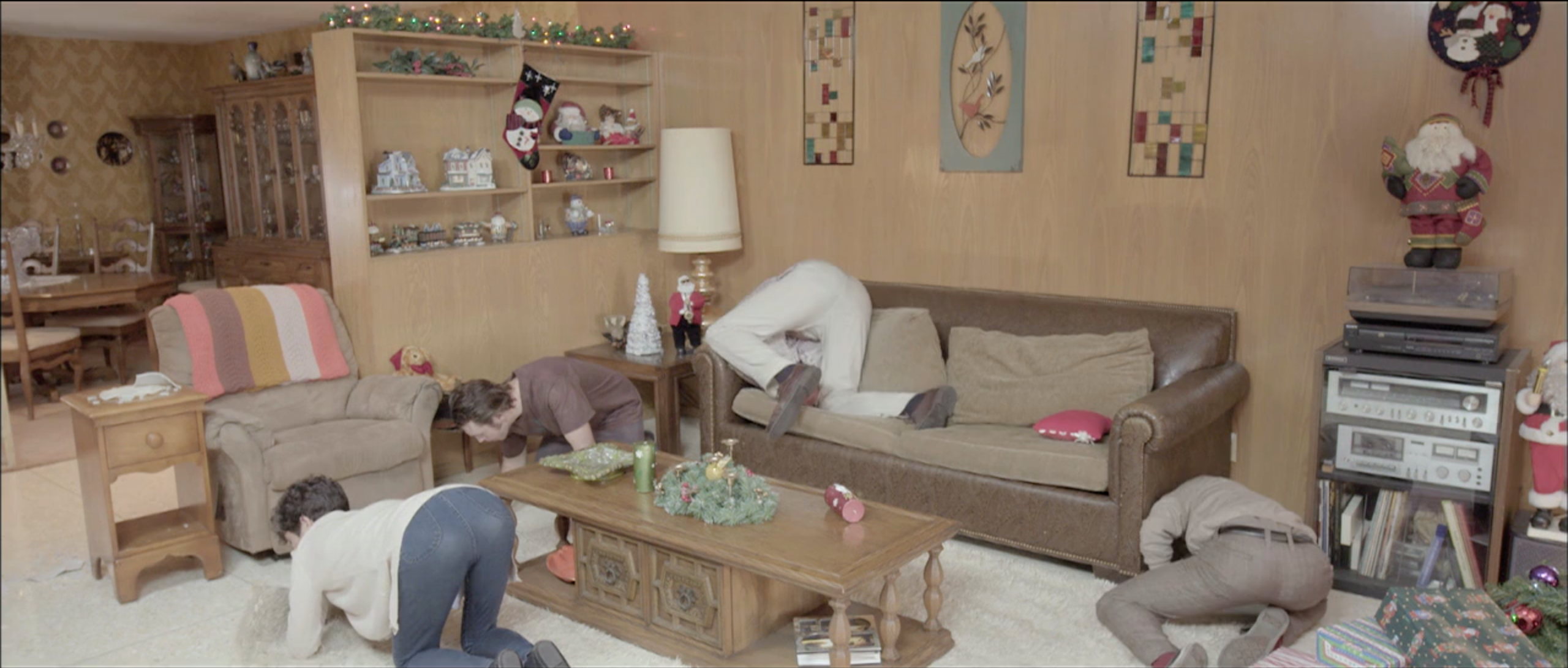 1970s family living room fully dressed for Christmas in Takanakuy, production design by Myra Barrera