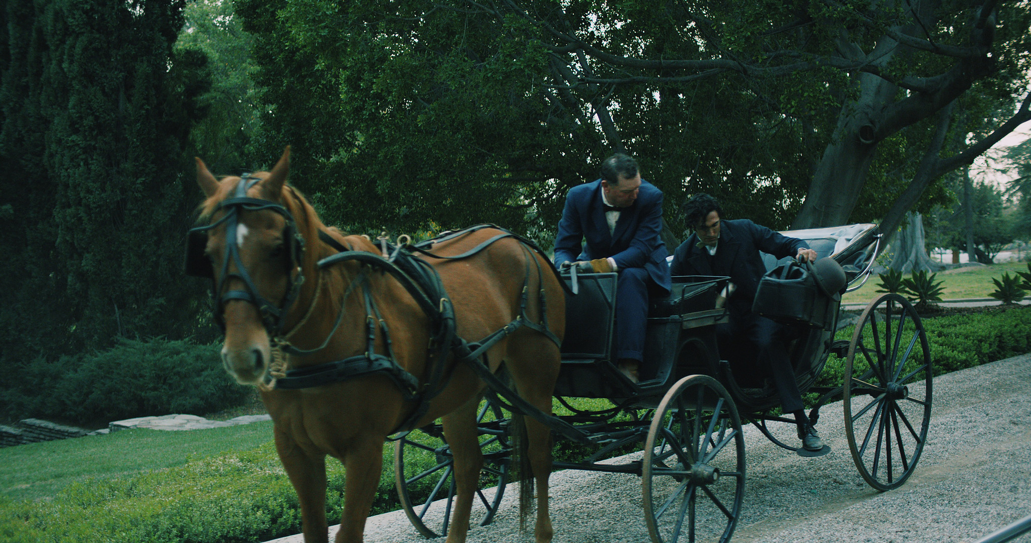 Horse-drawn carriage on the asylum drive in The Mad Whale, period exterior dressed by set decorator Myra Barrera